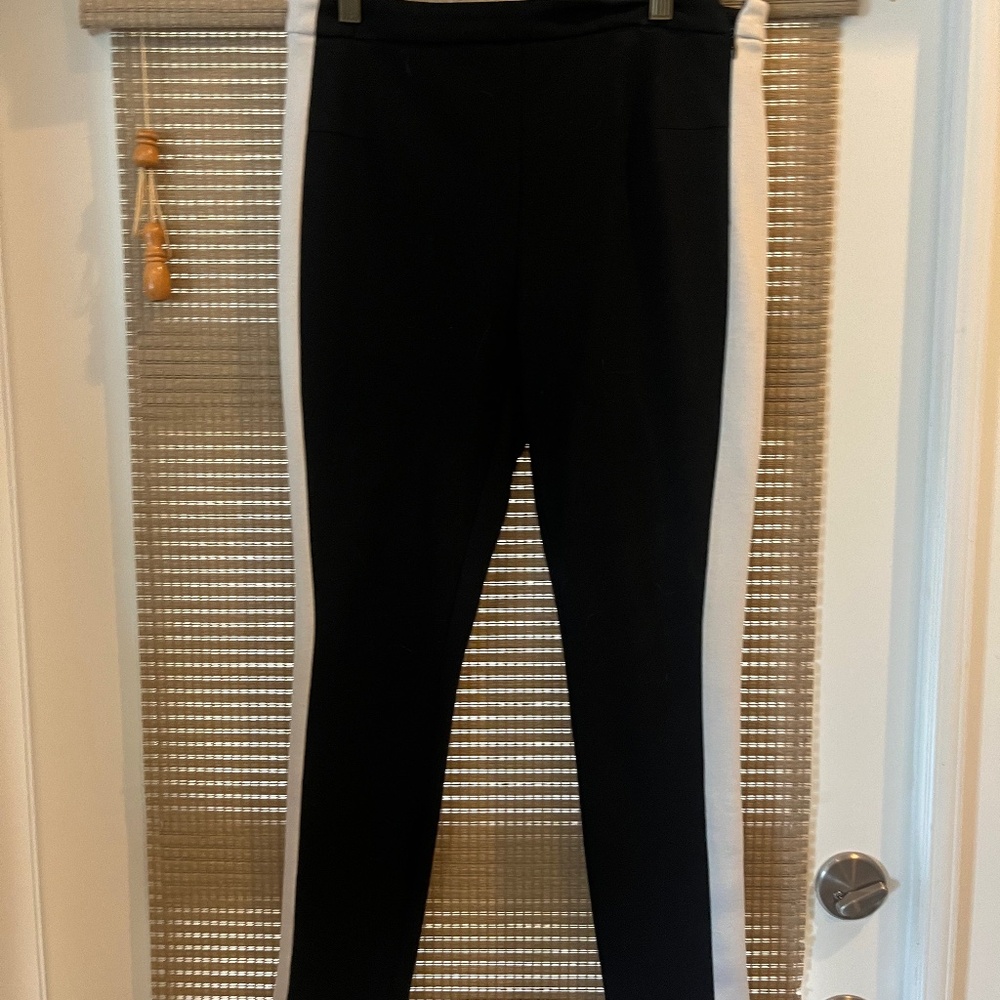 Black straight leg pants with white stipe on sides